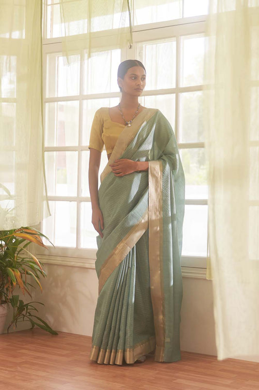 Teal gold zari woven saree