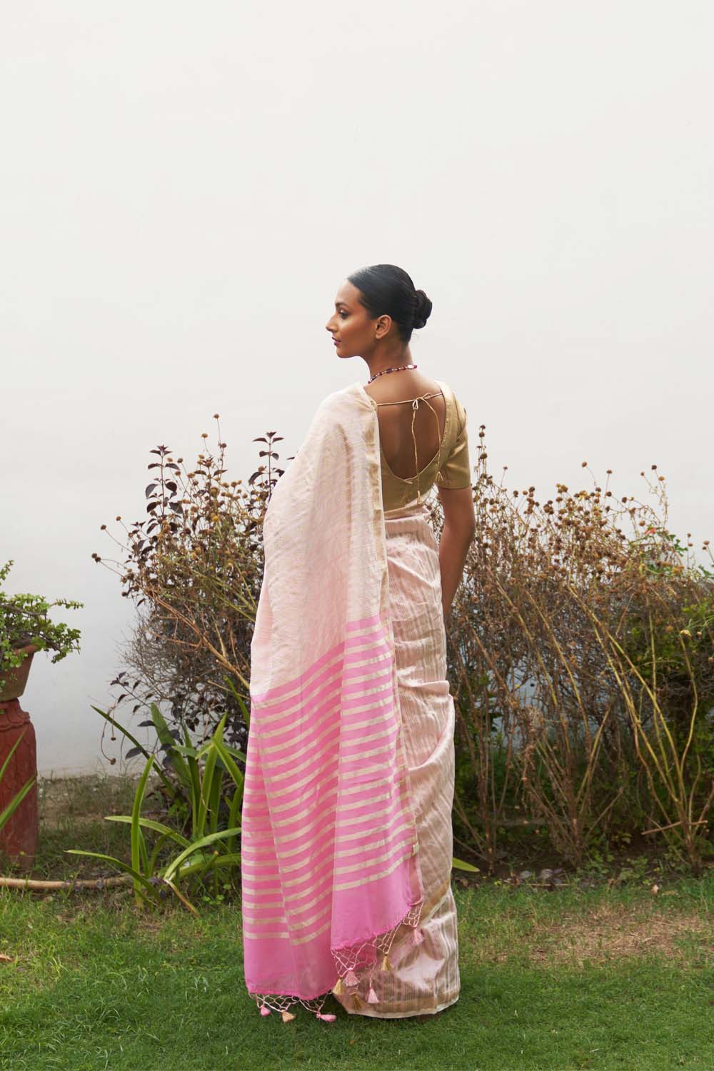 Pink asymmetric gold zari stripe saree